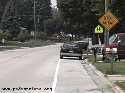 Photo - Painted lines in the street instead of sidewalks.