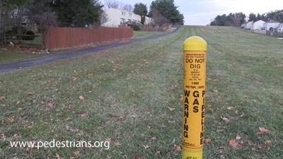 photo - wide grassy ROW with paved trail.